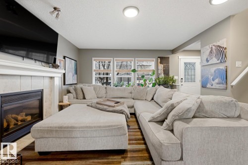 5851 Sutter Place, Edmonton, AB - Indoor Photo Showing Living Room With Fireplace