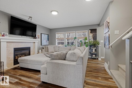 5851 Sutter Place, Edmonton, AB - Indoor Photo Showing Living Room With Fireplace
