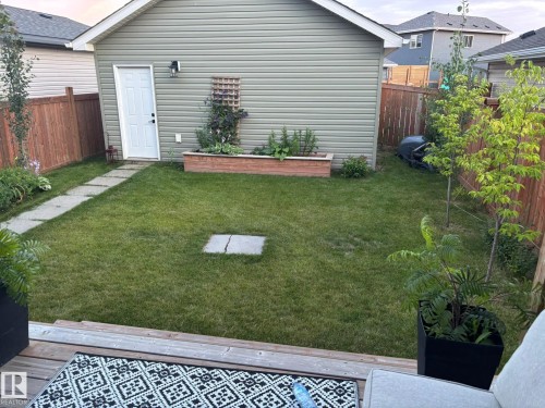 View of fenced backyard - 25 Harrison Gate, Spruce Grove, AB - Outdoor With Exterior