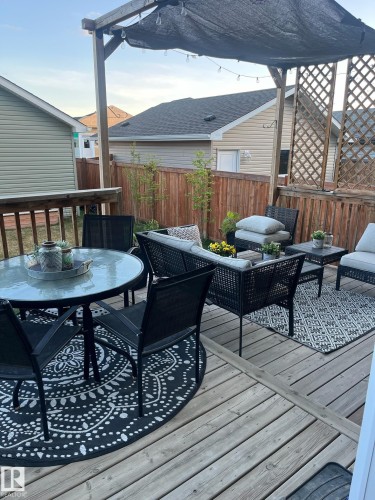 Wooden terrace featuring outdoor lounge area and outdoor dining space - 25 Harrison Gate, Spruce Grove, AB - Outdoor With Deck Patio Veranda With Exterior