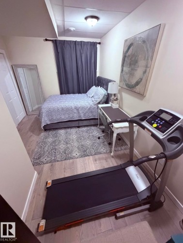 Bedroom featuring light wood-style floors and baseboards - 25 Harrison Gate, Spruce Grove, AB - Indoor Photo Showing Bedroom