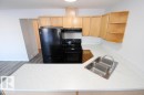 7 451 Hyndman Crescent, Edmonton, AB  - Indoor Photo Showing Kitchen With Double Sink 