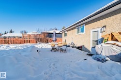 Snowy yard with a patio area - 