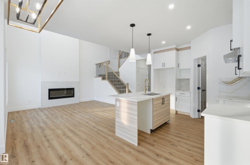 63 Silverstone Drive, Stony Plain, AB - Indoor Photo Showing Other Room With Fireplace