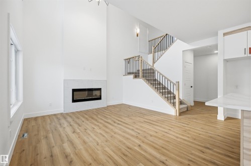 63 Silverstone Drive, Stony Plain, AB - Indoor Photo Showing Living Room With Fireplace
