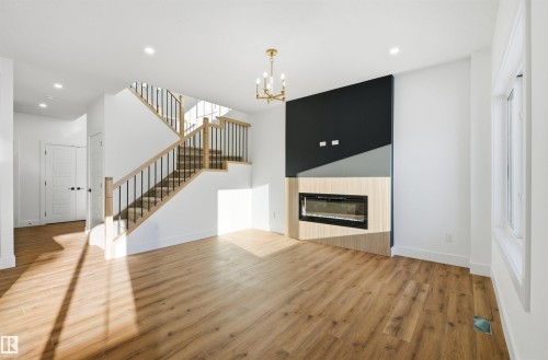 65 Silverstone Drive, Stony Plain, AB - Indoor Photo Showing Other Room With Fireplace