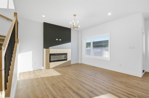 65 Silverstone Drive, Stony Plain, AB - Indoor Photo Showing Living Room With Fireplace