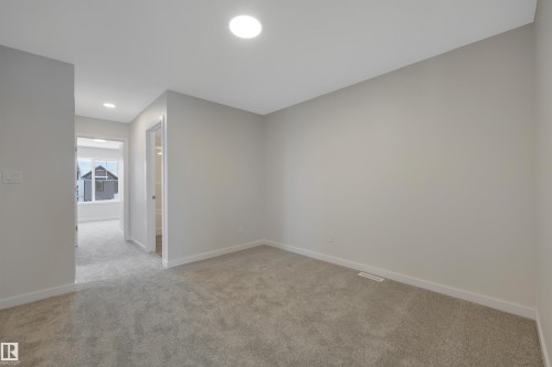 Empty room with light colored carpet and recessed lighting - 5742 Hawthorn Common, Edmonton, AB - Indoor Photo Showing Other Room
