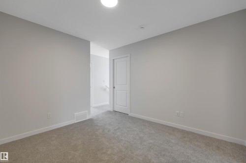 Empty room with carpet and baseboards - 5742 Hawthorn Common, Edmonton, AB - Indoor Photo Showing Other Room