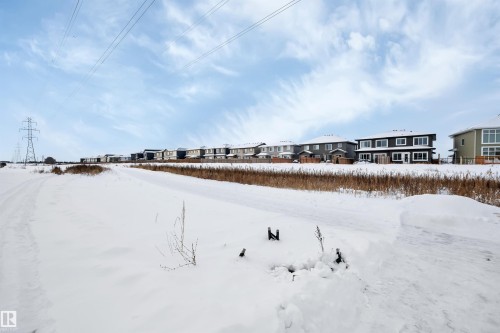 View of property's community with a residential view - 5742 Hawthorn Common, Edmonton, AB - Outdoor With View