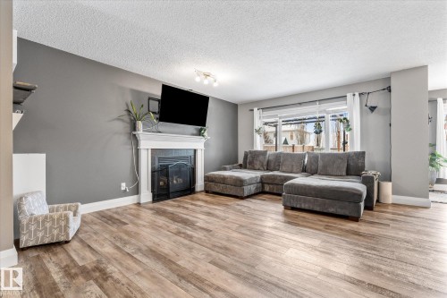 5 South Creek Point(E), Stony Plain, AB - Indoor Photo Showing Living Room With Fireplace