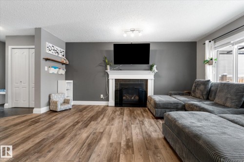 5 South Creek Point(E), Stony Plain, AB - Indoor Photo Showing Living Room With Fireplace