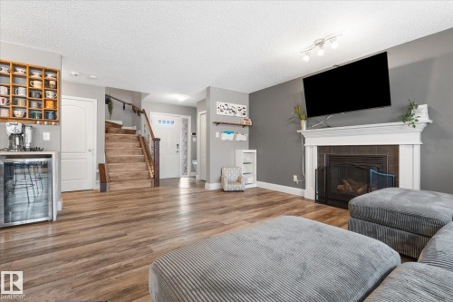 5 South Creek Point(E), Stony Plain, AB - Indoor Photo Showing Living Room With Fireplace