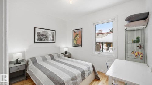 Bedroom featuring wood finished floors - 9831 83 Avenue, Edmonton, AB - Indoor Photo Showing Bedroom