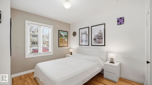 Bedroom featuring light wood-style floors and baseboards - 9831 83 Avenue, Edmonton, AB - Indoor Photo Showing Bedroom