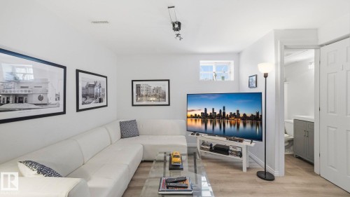 Living area with light wood finished floors - 9831 83 Avenue, Edmonton, AB - Indoor