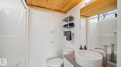 Bathroom with wood ceiling and vanity - 9831 83 Avenue, Edmonton, AB - Indoor Photo Showing Bathroom