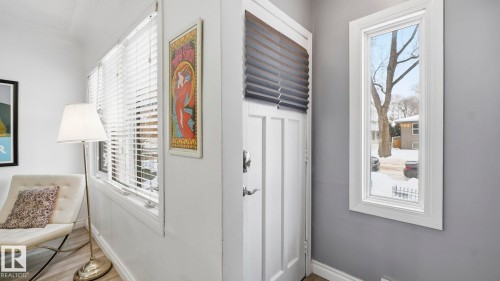 Detailed view of wood finished floors and baseboards - 9831 83 Avenue, Edmonton, AB - Indoor Photo Showing Other Room