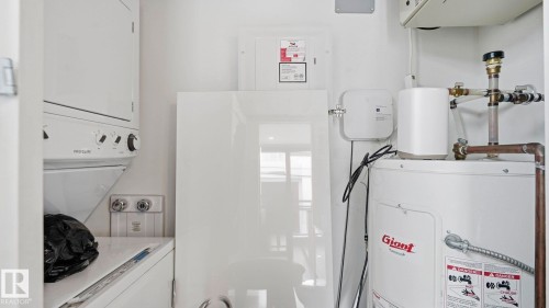 Utility room with water heater - 9831 83 Avenue, Edmonton, AB - Indoor Photo Showing Laundry Room