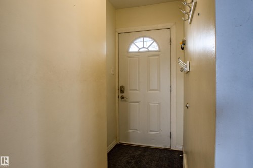 Doorway featuring baseboards and tile patterned floors - 9228 124A Avenue, Edmonton, AB - Indoor Photo Showing Other Room