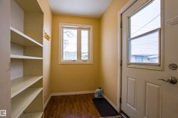 Entryway with baseboards and wood finished floors - 