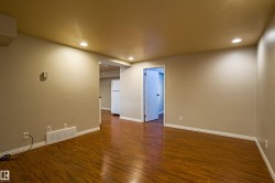 Unfurnished room featuring dark wood-style floors and recessed lighting - 