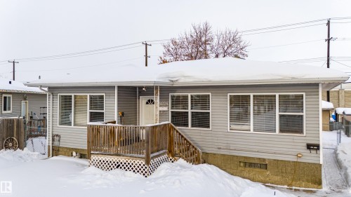 View of front of property with a wooden deck - 9228 124A Avenue, Edmonton, AB - Outdoor