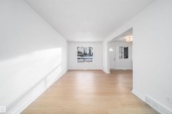 Unfurnished room featuring light wood-style floors and baseboards - 