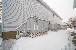 Snow covered property with a deck - 