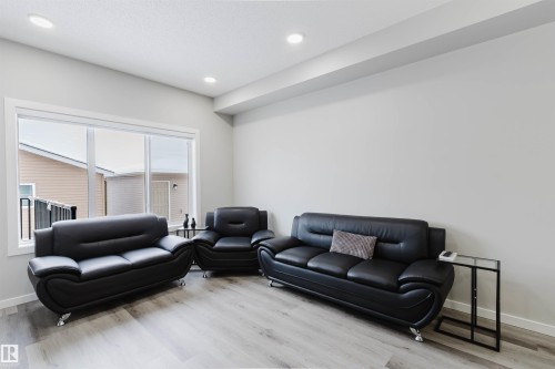 Living area with wood finished floors and recessed lighting - 343 Edgemont Drive, Edmonton, AB - Indoor Photo Showing Living Room