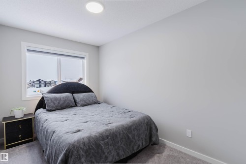 Carpeted bedroom with baseboards - 343 Edgemont Drive, Edmonton, AB - Indoor Photo Showing Bedroom