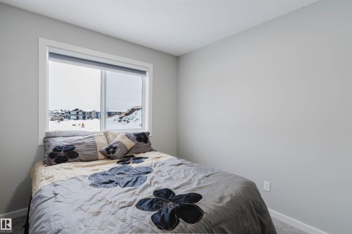 Carpeted bedroom with baseboards - 343 Edgemont Drive, Edmonton, AB - Indoor Photo Showing Bedroom
