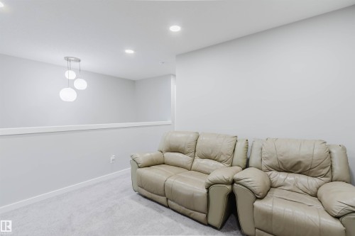 Living room featuring carpet flooring and recessed lighting - 343 Edgemont Drive, Edmonton, AB - Indoor
