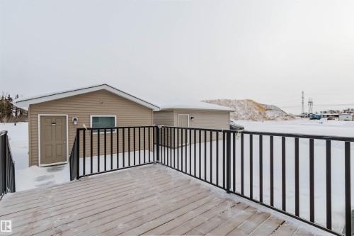 Snow covered deck with a mountain view - 343 Edgemont Drive, Edmonton, AB - Outdoor With Exterior