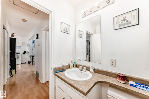 Half bathroom featuring vanity and light wood-type flooring - 15515 92A Avenue, Edmonton, AB - Indoor Photo Showing Bathroom