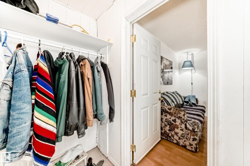 Mudroom with light wood finished floors and a textured ceiling - 15515 92A Avenue, Edmonton, AB - Indoor With Storage