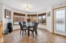 Dining area with healthy amount of natural light and a textured ceiling - 15411 67A St, Edmonton, AB  - Indoor Photo Showing Dining Room 