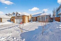 Ranch-style home featuring an attached garage - 