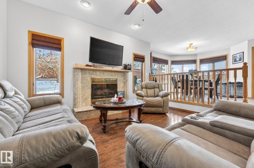15411 67A St, Edmonton, AB - Indoor Photo Showing Living Room With Fireplace
