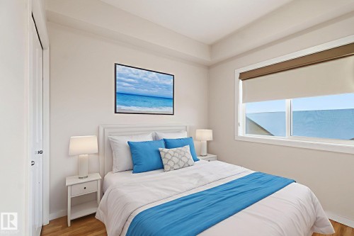 Bedroom featuring wood finished floors and baseboards - 405 9517 160 Avenue, Edmonton, AB - Indoor Photo Showing Bedroom