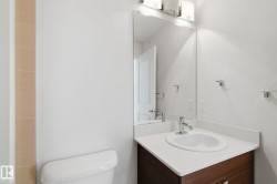 Bathroom with vanity and toilet - 