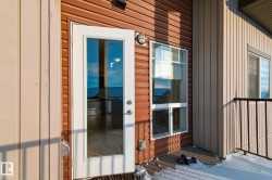 Doorway to property with board and batten siding - 