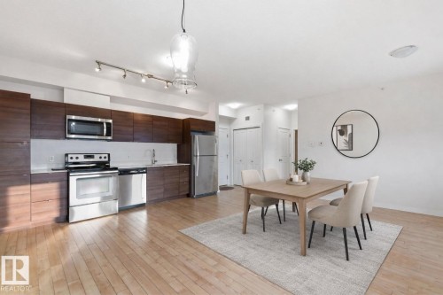 Dining space featuring light wood-style floors - 405 9517 160 Avenue, Edmonton, AB - Indoor