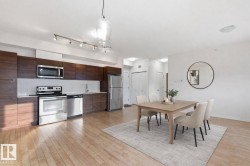 Dining space featuring light wood-style floors - 