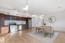 Dining space featuring light wood-style floors - 405 9517 160 Avenue, Edmonton, AB  - Indoor 