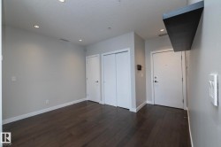 Unfurnished bedroom featuring dark wood-style flooring, recessed lighting, and a closet - 