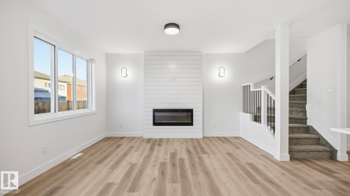 108 Spring Link, Spruce Grove, AB - Indoor Photo Showing Living Room With Fireplace