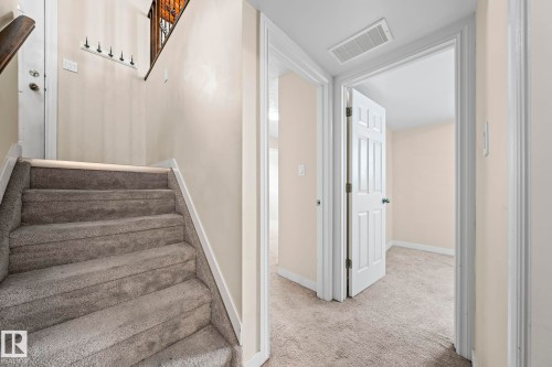 Staircase with carpet floors and baseboards - 15 Northwoods Village, Edmonton, AB - Indoor Photo Showing Other Room