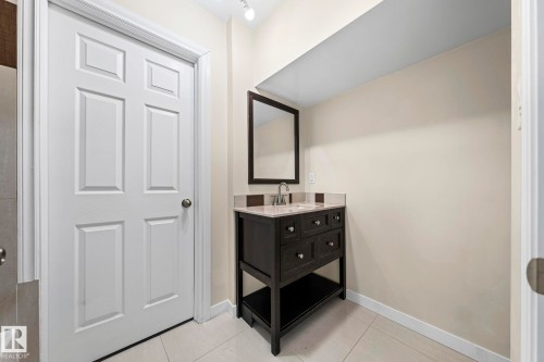 Bathroom featuring vanity and light tile patterned floors - 15 Northwoods Village, Edmonton, AB - Indoor