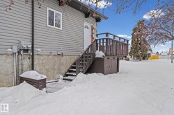 View of snow covered rear of property - 